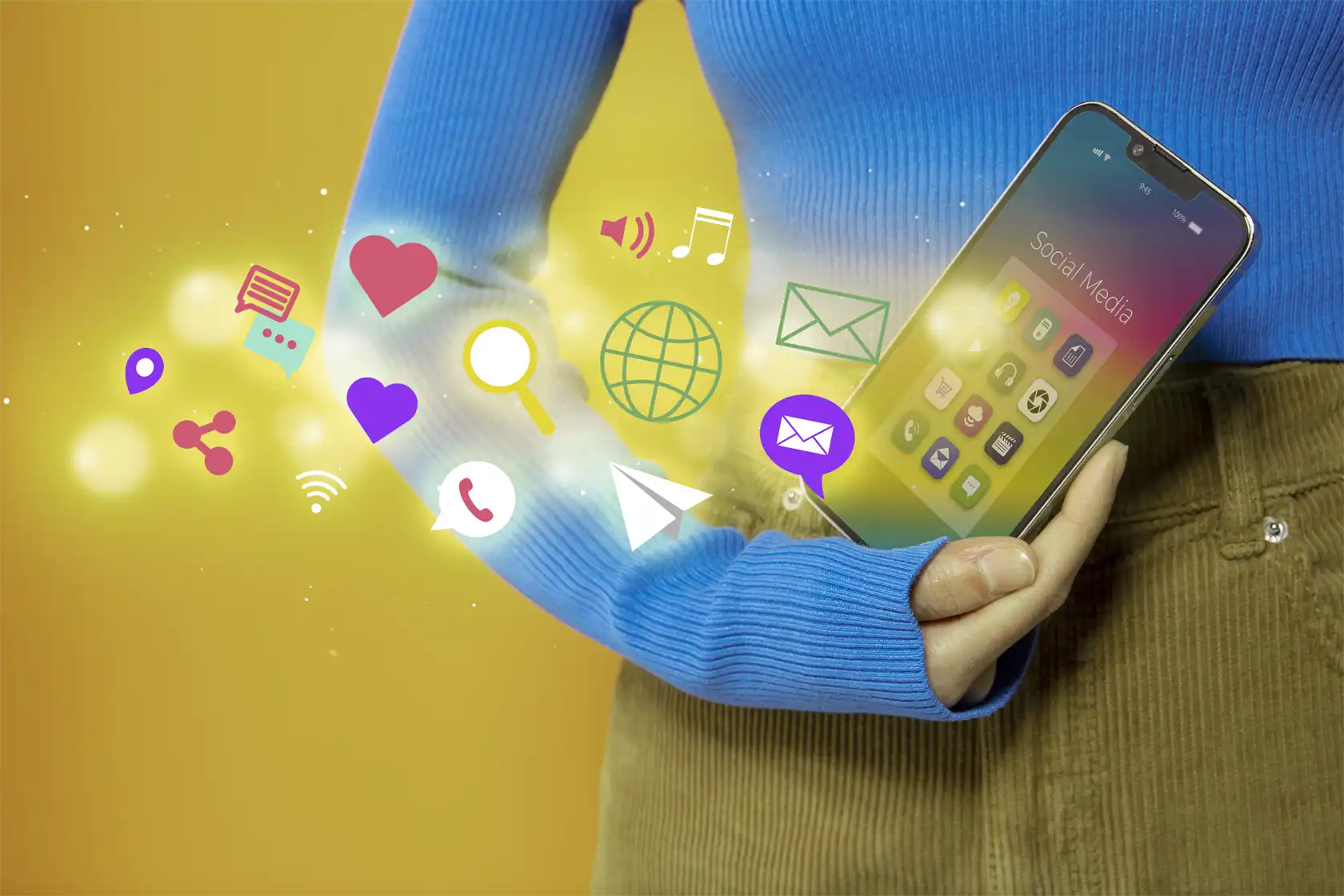 Woman holding a phone with social media platforms inside it and visual outside.