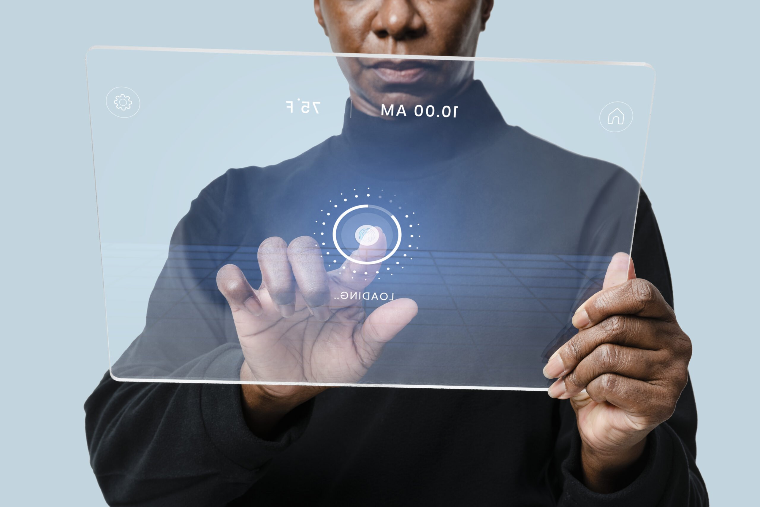 A woman using her transparet tablet and pressing her finger on it through hologram