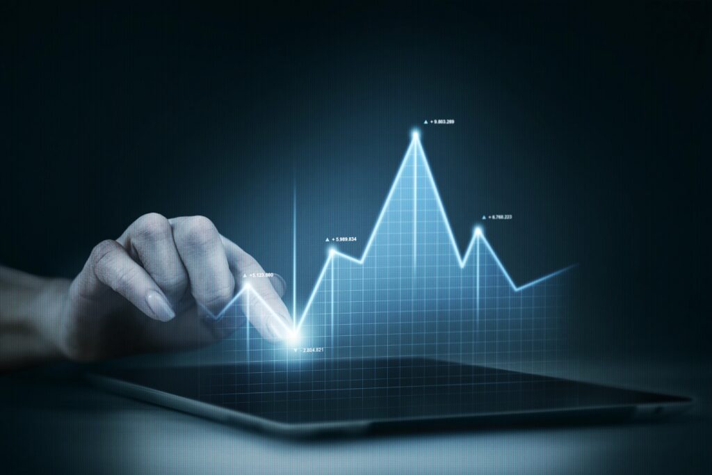 A hand pointing on a hologram chart