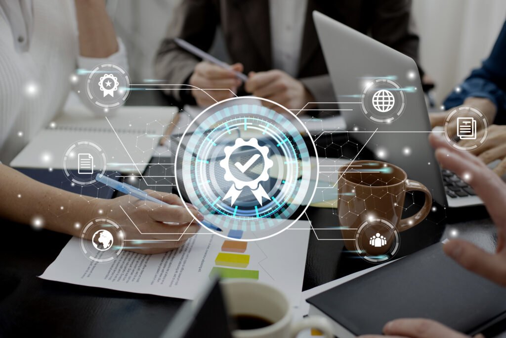 Buisness pople in a meeting with laptops and spreadsheets on the table and blue and white hologram in the foreground