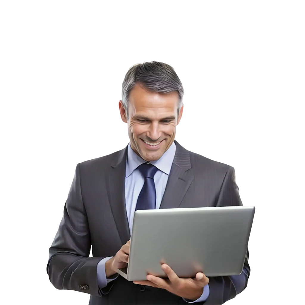 A businessman in a stylish suit, smiling as he works on his laptop, exuding confidence and professionalism.